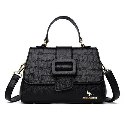 Black handbag with textured pattern and visible brand logo on a white background