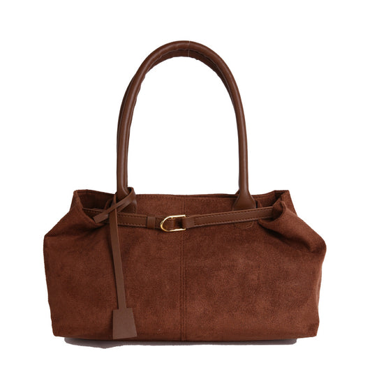 Brown handbag with a strap on a white background