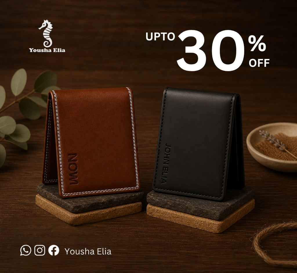 Two leather wallets, one brown and one black, on stands with 'Yousha Elia' branding and a discount offer.